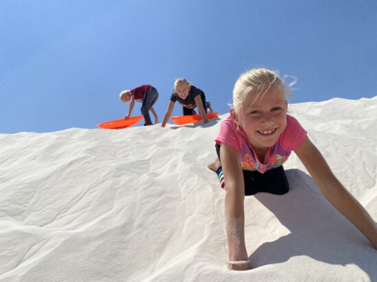 Daniel, Elle and Cami Piening sand sledding