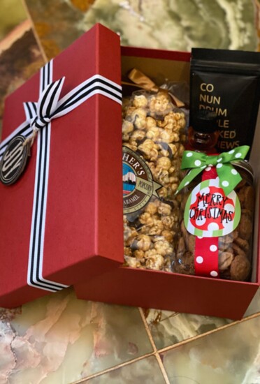 Custom gift box. Assorted items including popcorn and artisan honey. Contact us them pricing.