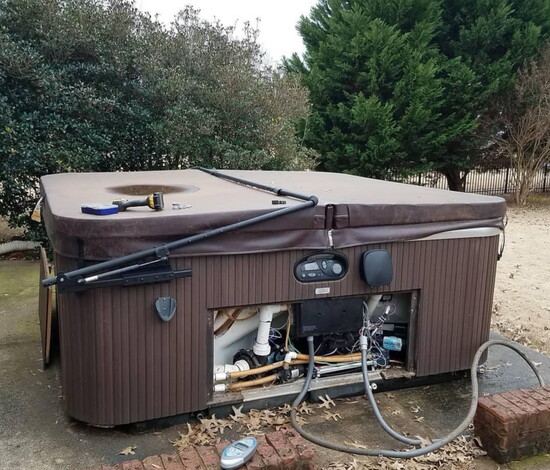 This hot tub was removed for an owner. 