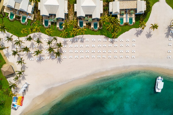 Stillness in motion. Waves gently kiss the sun-drenched white sandy beaches.