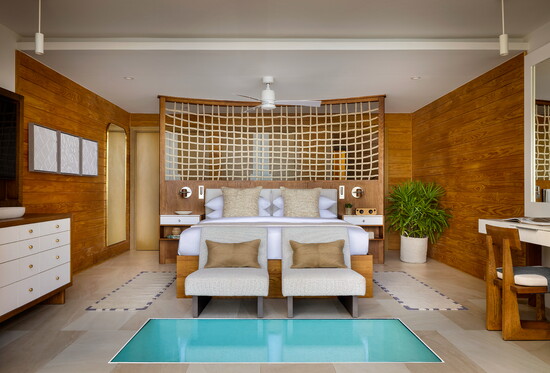 The Overwater Villa's second story primary suite is a perfect retreat! 