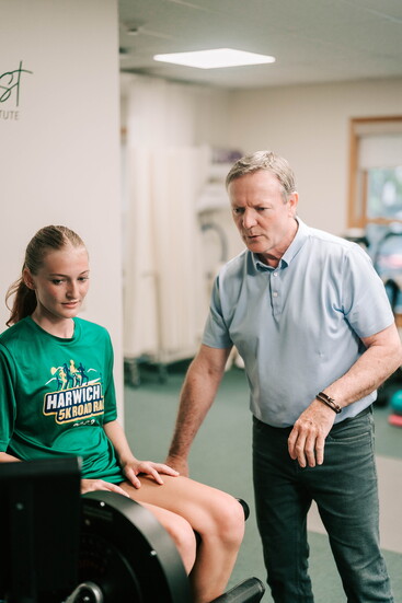 Brian Mullins helping a patient.