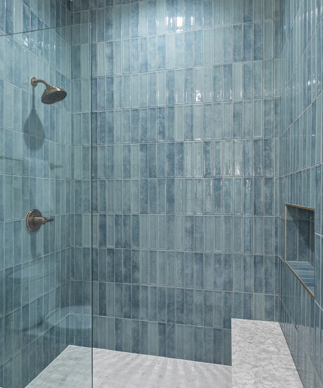 Glossy blue tile gives the shower a rich sense of depth, texture and handcrafted character.