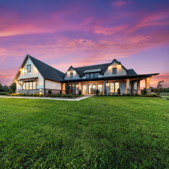 At twilight, the Collins reveals the architectural vision that earned statewide recognition for Best Architectural Design.