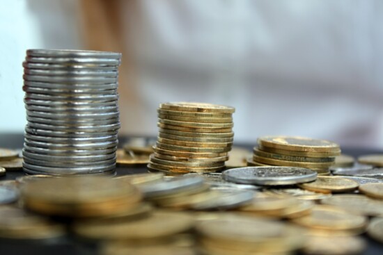 Coins piled and scattered.