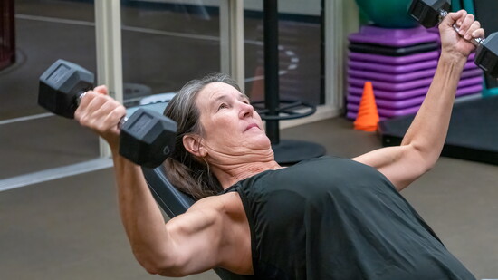 Julie Poole gets in some light weight training.