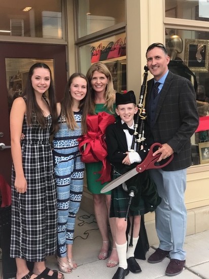 Owner of Eva Bryn Shoetique, Kelly Carney, with her family
