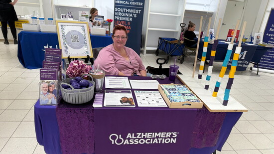 An Alzheimer's awareness table at a community event. Photo Credit: Alzheimer's Association Central and Western Virginia Chapter.