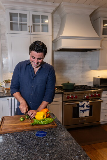 Keegan McManus cooking for his client