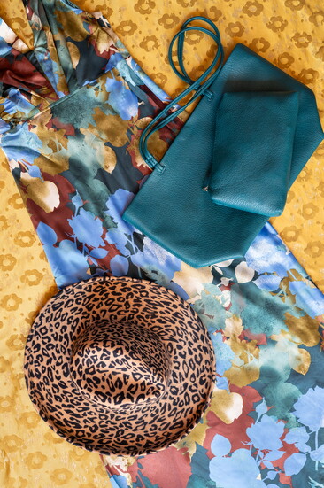 Teal becomes a transformative thread, turning quiet botanicals into bold, cinematic color. Stock and Belle.