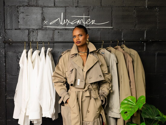 Designer Chelsey Carter-Sanders wears her signature trench coat in her Chicago studio. Photo by Christian