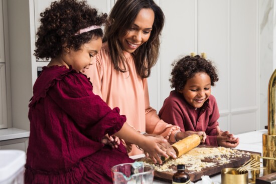 Toni and Earl Strong cooking with their children. 