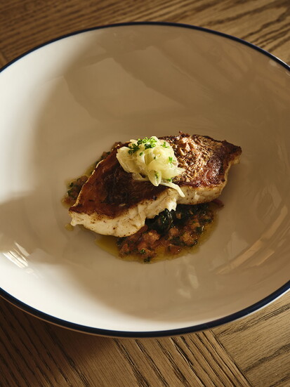 Seared snapper, sweet & sour Swiss chard, onion soubise, tomato brown butter. Photo by Frank Francis