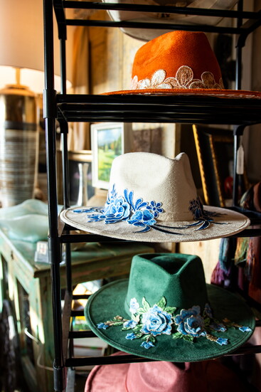 Hats complete Style 208's collection of Western-inspired accessories, displayed alongisde custom boots and other distinctive finds.