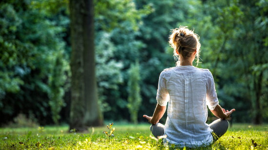 A person meditating.