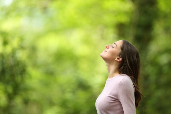 A woman breathing deeply.