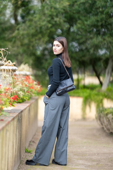 Woman in wide leg trousers.