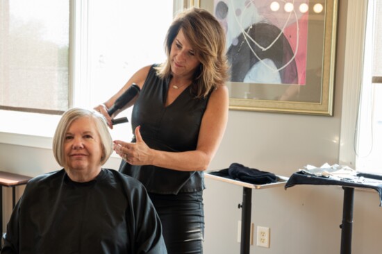 Senior Stylist, Heather Hogan, doing a classic cut. Photo by Jenna Beers. 