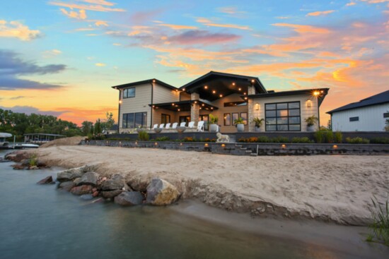 Lakeside ambiance accents this stunning home's exterior finishes.