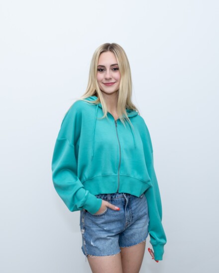 Turquoise Fleece Cropped Hoodie, zip front, great spring color, perfect staple for any wardrobe.  Denim Shorts, high rise with a rhinestone trim; flirty and fun