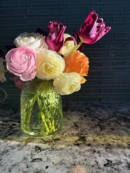 flowers placed in a small vase on your countertop starts your day off right.