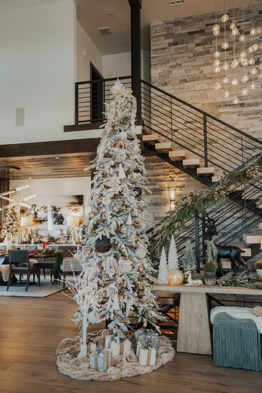 Flocked branches, simple accents, and hushed tones bring modern luxury to life.