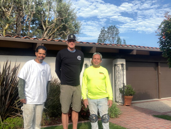Manhattan Paint Company owner Peter Kelley ( in the center) and his team.