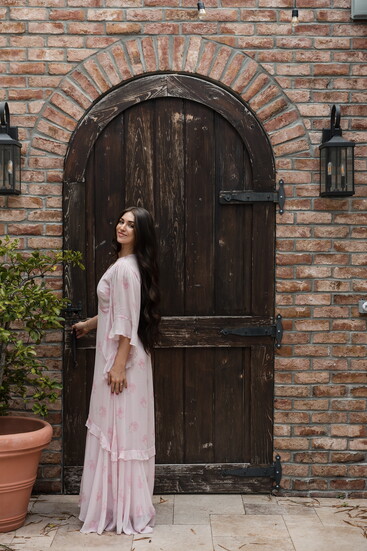 Soft/romantic feeling carries through wardrobe + setting.