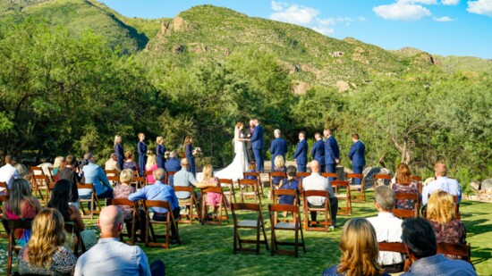 A young couple begin their lovely marriage surround by friends and desert beauty