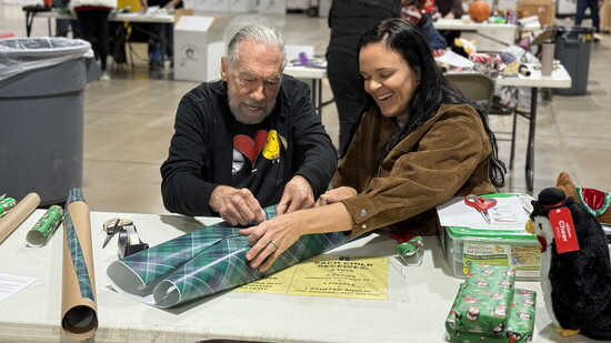 John Paul wrapping gifts at Brown Santa