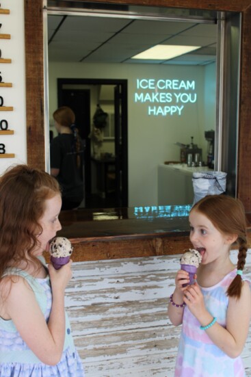 Allie, 9, and Lexi, 7, daughters of Randall and Whitney Holmes, enjoy cones at Seven Daughters Scoops.
