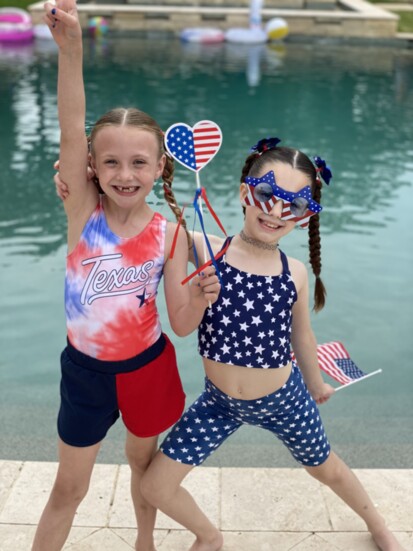 Ava and Rae enjoy a Fourth of July Celebration in a Claffey Pool at the home of Larry and Hope Evans