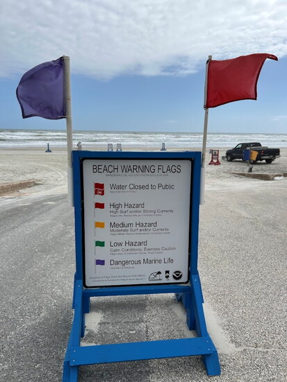 Always know water conditions by understanding the color system for beach warning flags.(Photo Credit: Volusia County Beach Safety & Ocean Rescue)