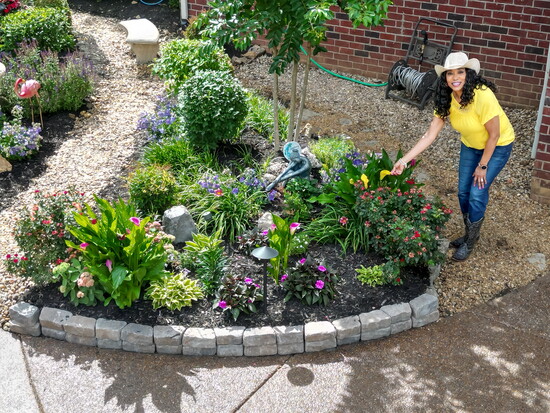 Towana Bowles spreads color in her home garden.