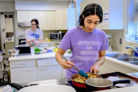 Hanan Baba, Senior Dietetic at MTSU prepares Batata Harra