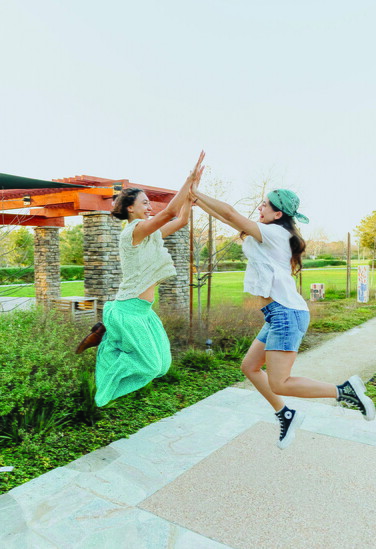 A mid-air high five captures the energy of the Pathways annual retreat. 