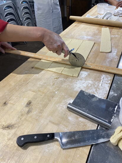 The chef walking us through step-by-step making savory and sweet handmade crossaints.