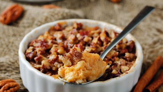 Thanksgiving Sweet Potato Pecan Bake topped with toasted pecans, ready for sharing.