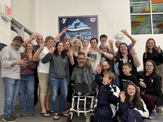 The Boise YMCA Team helps Bowen Toomey celebrate setting four American swimming records.