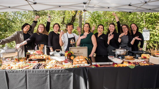 DeAnna Bailey-Sanchez (center in green) & the talented team at Bailey Family Catering in Madeira.