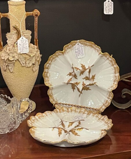 Items, such as these beautiful French oyster plates and vases at GasLamp Antiques, also can be purchased online. 