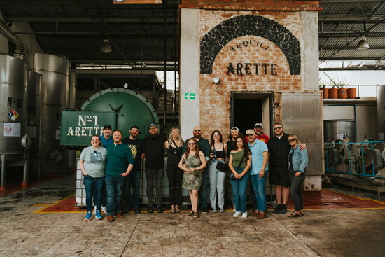 The Luna's team enjoy a tour of the barrel room at Tequila Arette.