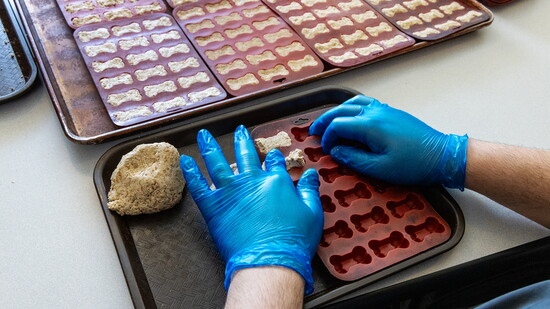 Employees shape each bone by hand, a small-batch operation that builds community from start to finish.