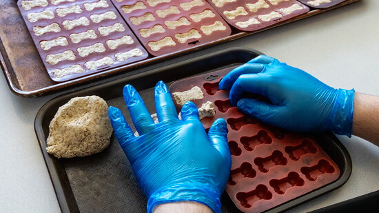 Employees shape each bone by hand, a small-batch operation that builds community from start to finish.