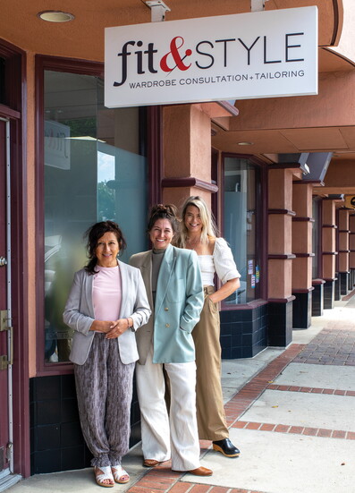 Christina Johnson (middle) poses with team members at her storefront.