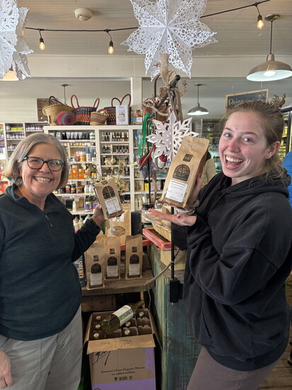 Loudoun County Wildlife Conservancy's Nan McCarry (left) picks up some coffee at Hamilton Mercantile with Ryann Israel. Photo: Becca Goode 