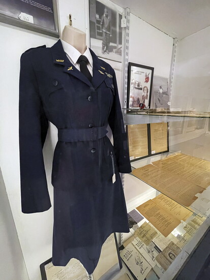 A display of the uniform + other memorabilia of World War II WASP Betty Stagg-Turner.