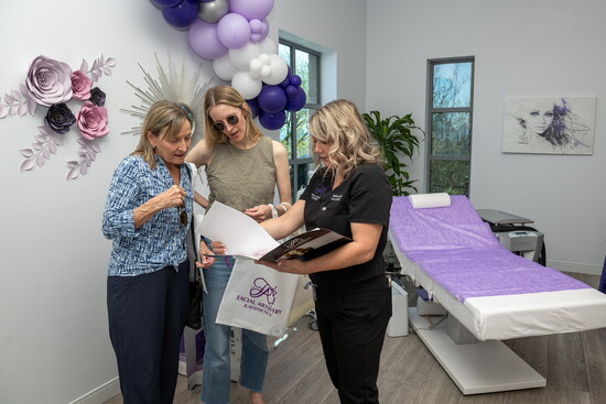 Melissa, our certified laser technician and licensed Aesthetician, consulting with our lovely guests.
