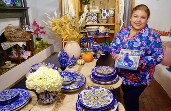 Mexican artist Isabelle Collins holds a piece of talavera tile from the 17 century.