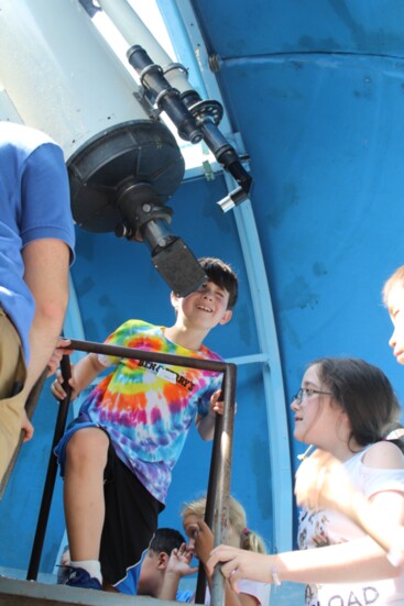 Talcott Mountain Science Academy students use the center's telescope.